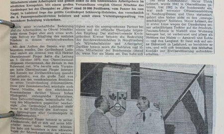 Zeitungsseite zeigt einen Artikel über den Kommandowechsel im Gerätedepot Ladelund mit einem Foto eines Handschlags.