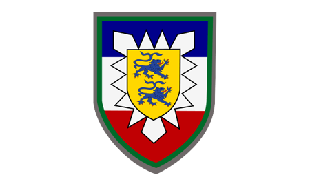 Ein farbenfrohes Wappen zeigt zwei blaue Löwen auf gelbem Schild, umgeben von einem stilisierten weißen Stern.