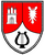 Ein Wappen zeigt eine Burg, eine stilisierte Sonne und eine Lyra auf rotem und weißem Hintergrund.