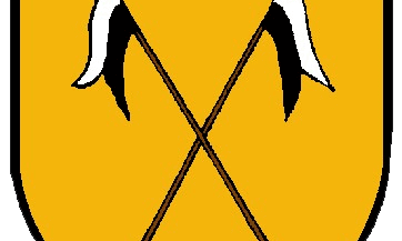 Ein gelbes Wappen zeigt zwei gekreuzte Lanzen mit schwarzen und weißen Fahnen.