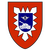Ein rotes Wappen mit einem blauen Schild zeigt einen Panzer und ein Flügelrad, umgeben von einem weißen Sternmuster.