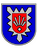 Ein Wappen zeigt einen blauen Hintergrund mit einem roten Schild und stilisierten Pfeilen im Zentrum.