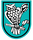Ein stilisiertes Wappen zeigt eine Eule, die auf einem Ast sitzt, umgeben von einem türkisfarbenen Hintergrund.