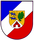 Ein Wappen zeigt zwei blaue Löwen, ein grünes Eichenblatt und ein rotes Tor auf einem goldenen Schild.