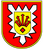 Ein rotes Wappen mit gelbem Schild zeigt ein zentrales Symbol mit drei Pfeilen und einem roten Diamanten.
