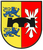 Ein Wappen zeigt zwei blaue Löwen auf gelbem Grund und eine schwarze Brücke auf rotem Grund mit einem weißen Stern.