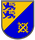 Ein zweigeteiltes Wappen zeigt zwei blaue Löwen und ein Zahnrad mit Schraubenschlüssel und Hammer auf gelbem und blauem Grund.