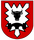 Ein rotes Wappen zeigt einen schwarzen Stierkopf und ein stilisiertes Zahnrad, symbolisch für die Pionierkompanie.