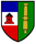 Das Wappen zeigt links ein rotes Fort auf Blau-Weiß und rechts eine goldene Kanone auf grünem Hintergrund.