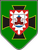 Auf einem grünen Schild ist ein rotes Schloss mit Türmen vor einem schwarzen Kreuz abgebildet.