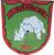 Ein weißes Nashorn steht auf einem grünen Wappen mit rotem Rand und der Aufschrift "2./PzArtBtl 515".