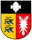 Ein Wappen zeigt zwei blaue Löwen auf gelbem Grund und ein weißes Nesselblatt auf rotem Grund, getrennt durch eine Linie.