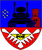 Ein Wappen zeigt einen Panzer, einen Turm und fliegende Vögel vor einem blauen Hintergrund über einem rot-weißen Muster. Wappen FlaLRgt 6